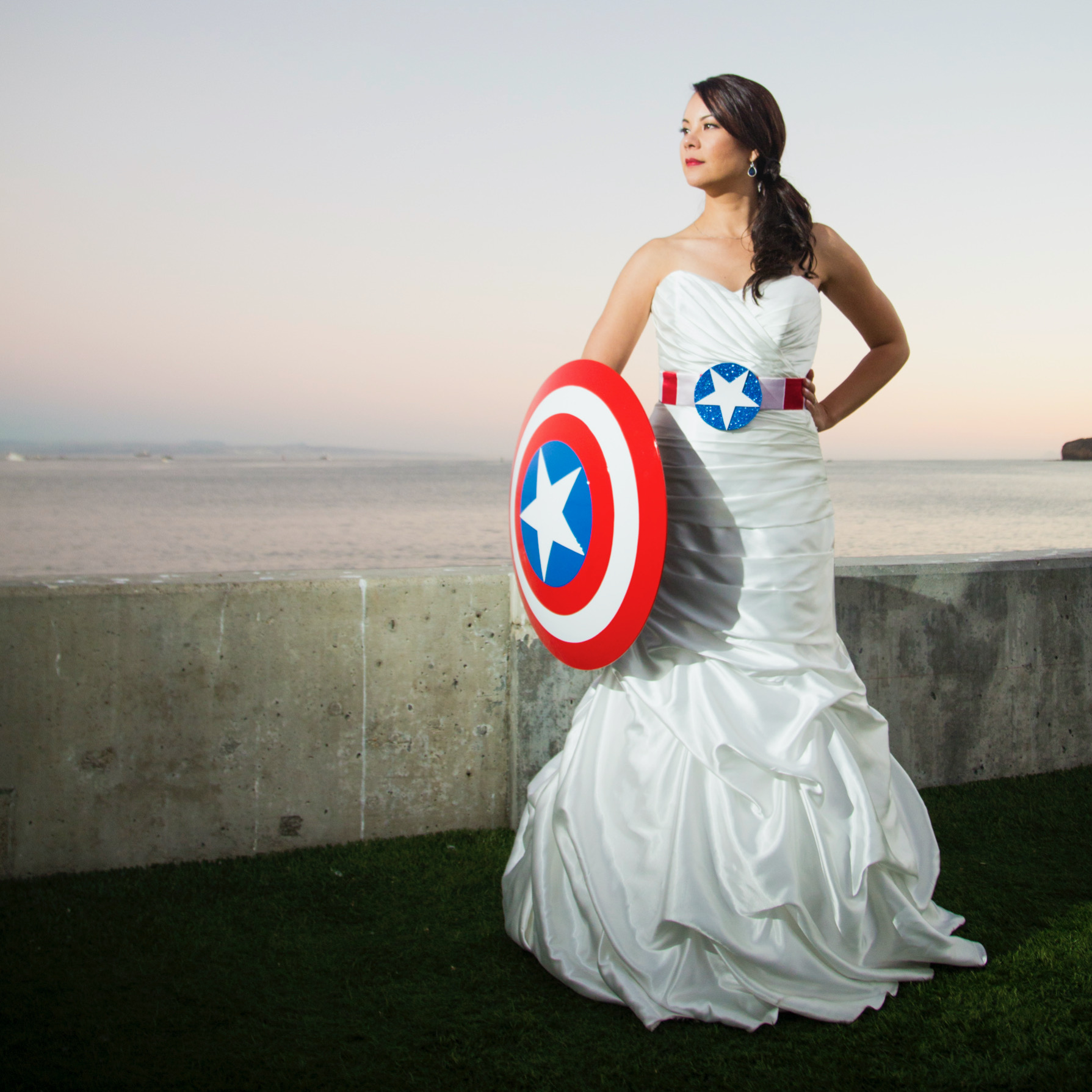 Photo of Trecia Lovering in wedding dress with Captian America shield